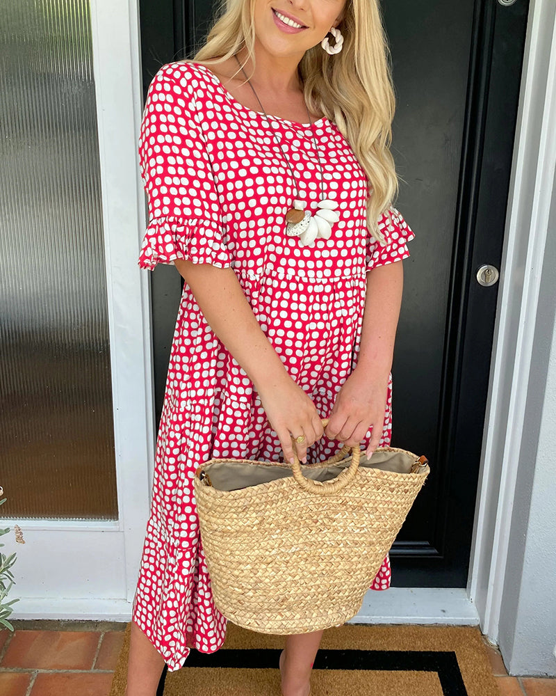 Élodie – Robe midi élégante à col rond avec un imprimé à pois charmant