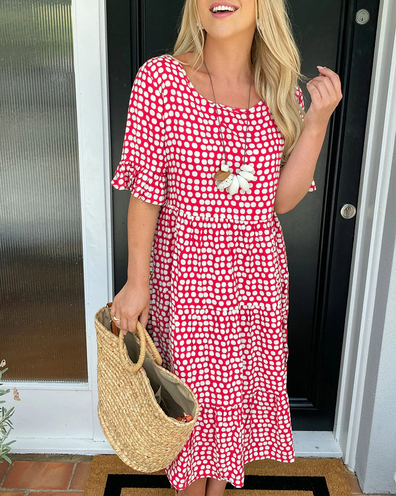 Élodie – Robe midi élégante à col rond avec un imprimé à pois charmant