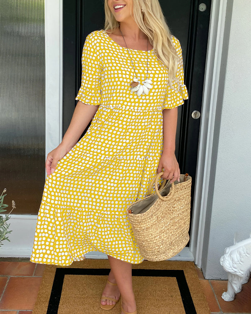 Élodie – Robe midi élégante à col rond avec un imprimé à pois charmant