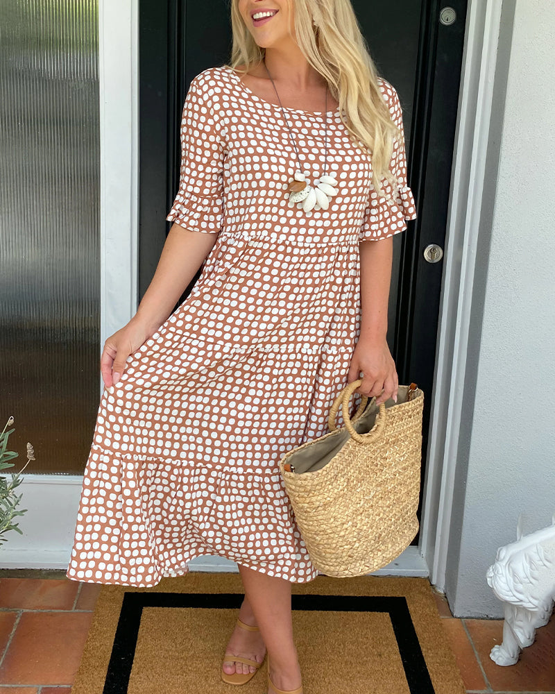 Élodie – Robe midi élégante à col rond avec un imprimé à pois charmant